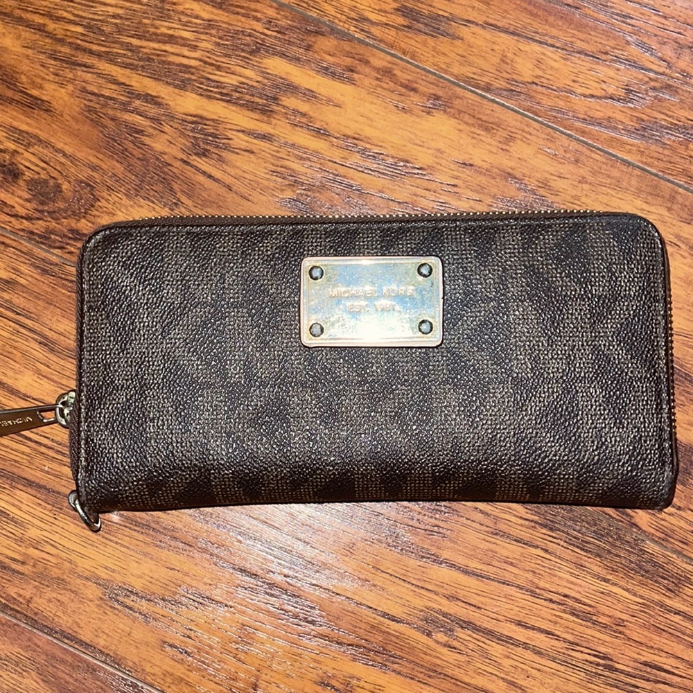 Brown Michael Kors wallet with zip-around entry
